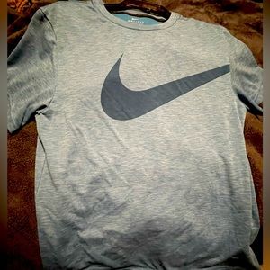 Nike dry fit shirt! Color is blue. Most accurate color is the one with the tag.